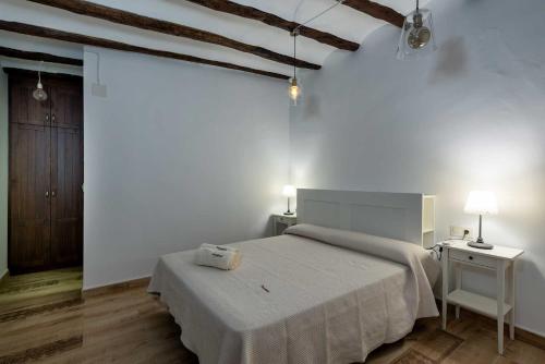Un pat sau paturi într-o cameră la Casa Rural Ensueño