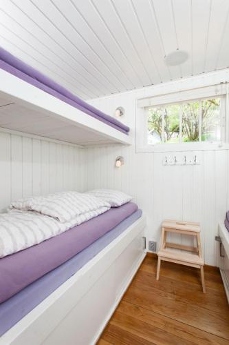 Katil atau katil-katil dalam bilik di Beach house in Oslo