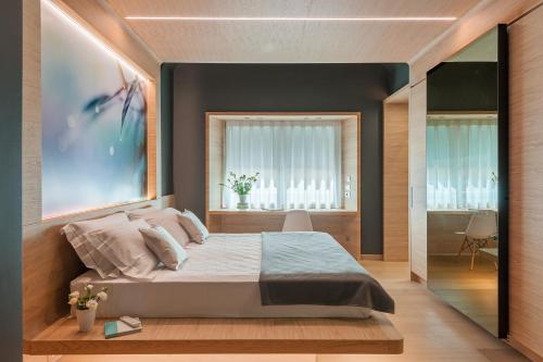 Tempat tidur dalam kamar di Air Suite Verona