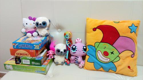 a group of stuffed animals sitting on top of books at Vila Silvia in Sovata