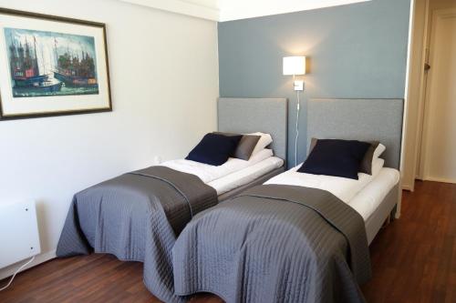Tempat tidur dalam kamar di Saltstraumen Hotel