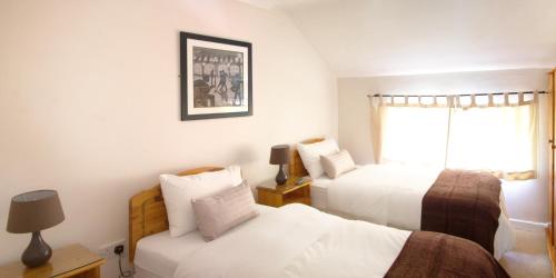 Ένα ή περισσότερα κρεβάτια σε δωμάτιο στο Woodside Lodge accomodation