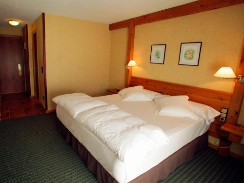 Katil atau katil-katil dalam bilik di Sport Hotel
