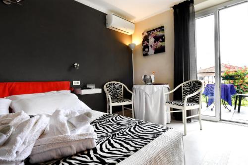 Postel nebo postele na pokoji v ubytování Hotel La Sacca