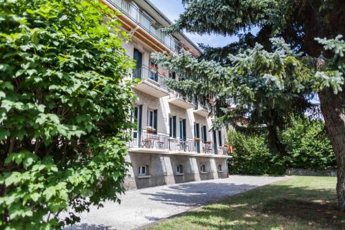 a building with balconies on the side of it at La Grande Eperviere in Barcelonnette