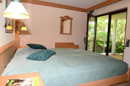 Llit o llits en una habitació de Residence am Weinberg / Travellers Hotelbetriebs GmbH
