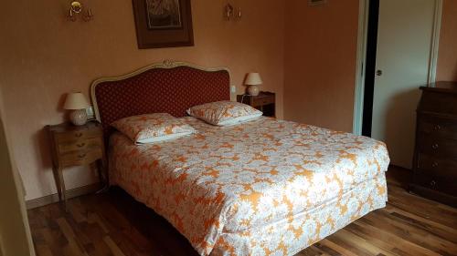 Ένα ή περισσότερα κρεβάτια σε δωμάτιο στο Chambres d'Hôtes l'Hermine
