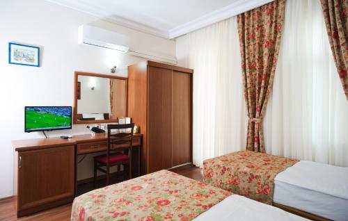 Postel nebo postele na pokoji v ubytování Triana Hotel