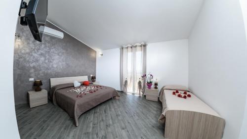 Posteľ alebo postele v izbe v ubytovaní B&B Villa Fiorita