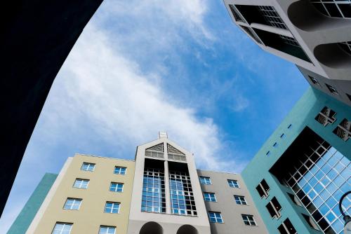 a tall building with the sky in the background at Novotel Firenze Nord Aeroporto in Sesto Fiorentino