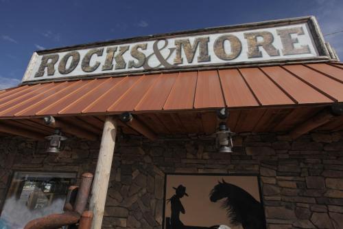 a building with a sign that reads rocks and more at Grand Canyon Inn and Motel - South Rim Entrance in Valle