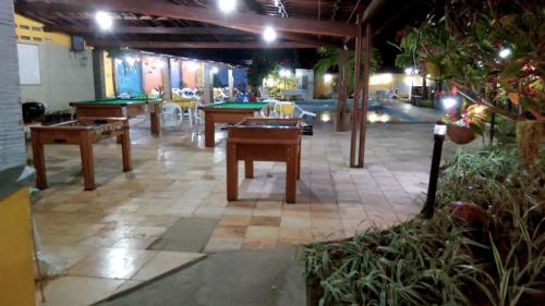 a room with billiard tables and a poolricular at Pousada Recanto do Sossego in Itamaracá