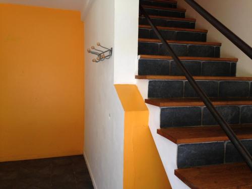 a set of stairs in a building with a railing at L'aire des oiseaux in Muno
