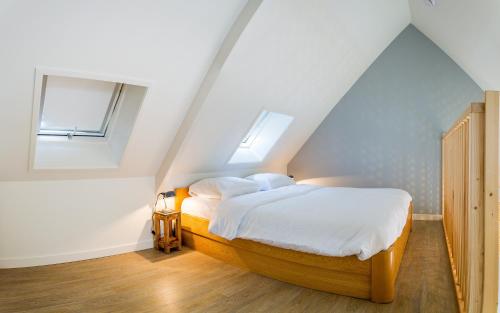 Ένα ή περισσότερα κρεβάτια σε δωμάτιο στο Slapen aan de Bosweg
