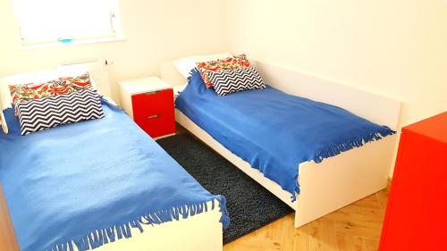 מיטה או מיטות בחדר ב-Apartament Eliza