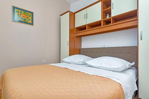 Postel nebo postele na pokoji v ubytování Apartment Neven