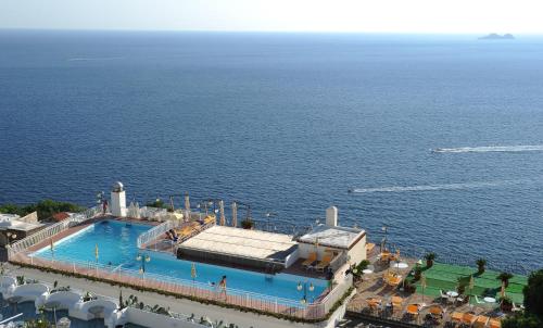 an overhead view of a swimming pool next to the ocean at Tramonto d'Oro in Praiano
