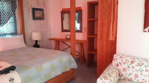 a bedroom with a bed and a couch in a room at Vista Marina Residence in Boca Chica