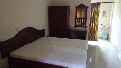 Postel nebo postele na pokoji v ubytování Hotel Nuhman
