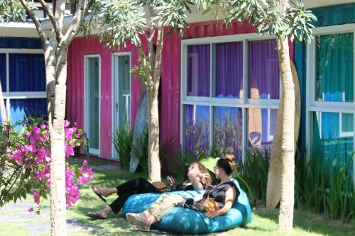 a group of people laying on an inflatableructure in a yard at Kubu Container in Uluwatu
