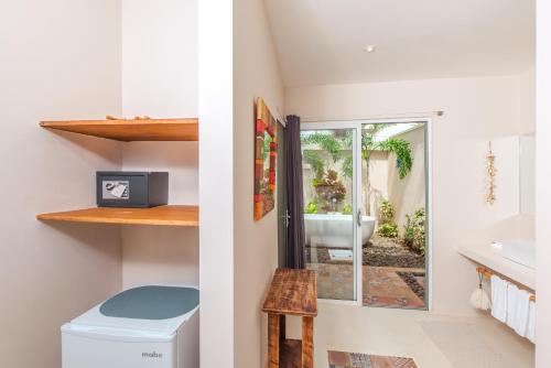a bathroom with a toilet and a sink at La Ramona Charming Hotel in Tamarindo