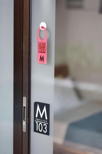 a door with a tag on the side of it at M Pavilion - Lippo Karawaci in Tangerang