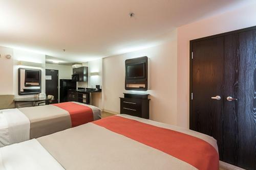 Postel nebo postele na pokoji v ubytování Motel 6-Moosomin, SK