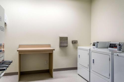 a room with a counter and a table in a room at Motel 6-Lincoln City, OR in Lincoln City