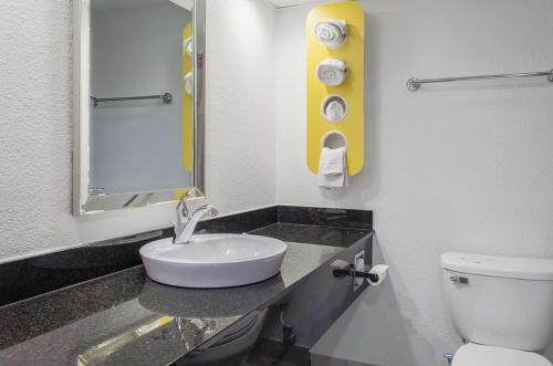 a bathroom with a sink and a toilet at Motel 6-Brockton, MA in Brockton