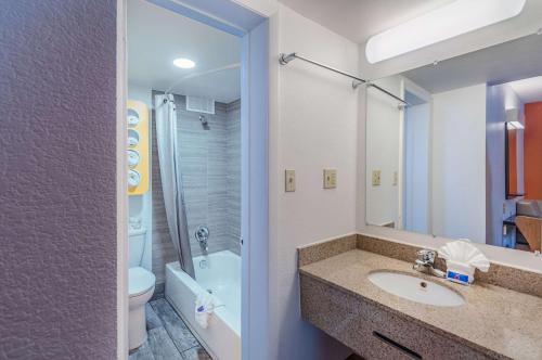 a bathroom with a sink and a toilet and a shower at Motel6 Winchester, VA in Winchester