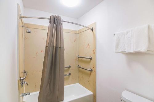 a bathroom with a shower and a toilet at Studio 6-Tyler, TX in Tyler