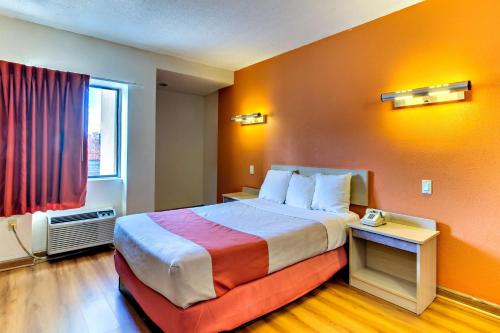 a hotel room with a bed and a window at Motel 6-Washington, DC in Washington, D.C.