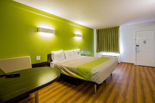 a hotel room with a bed and a table at Motel 6-Austin, TX - Midtown in Austin