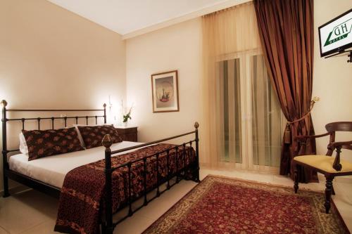 Postel nebo postele na pokoji v ubytování Green Hill Hotel