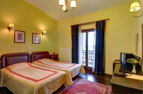 Ένα ή περισσότερα κρεβάτια σε δωμάτιο στο Naiades Hotel Resort & Conference