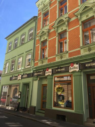 a green building on the side of a street at Ubytování U Pekaře in Děčín