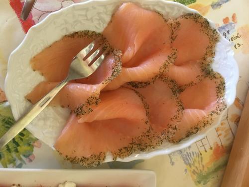 a plate of ham with a fork on it at Landhaus Heimisch Bed & Breakfast in Geisfeld