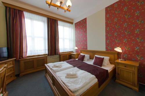 Postel nebo postele na pokoji v ubytování Hotel Soudek