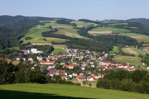 an aerial view of a village in the hills at VitalZeit Hotel Weber in Bad Schönau