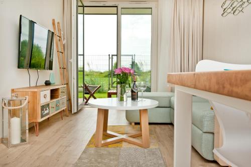 Televisyen dan/atau pusat hiburan di BlueApart Apartamenty Na Plaży Jastarnia