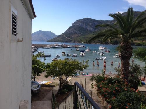 a view of a beach with boats in the water at Jerkovic Apartment in Žuljana