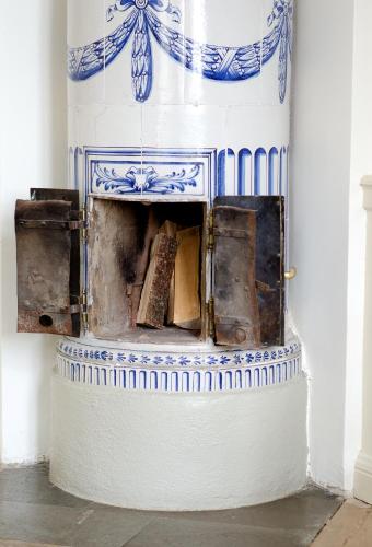 a fireplace in a room with blue and white at Riddersviks Herrgård in Stockholm