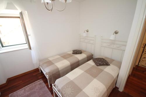 Postel nebo postele na pokoji v ubytování Dolce Vita Apartment