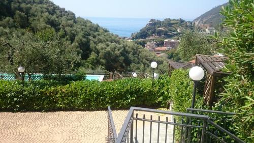 a stairway leading up to a house with a mountain at I Monili in Moneglia
