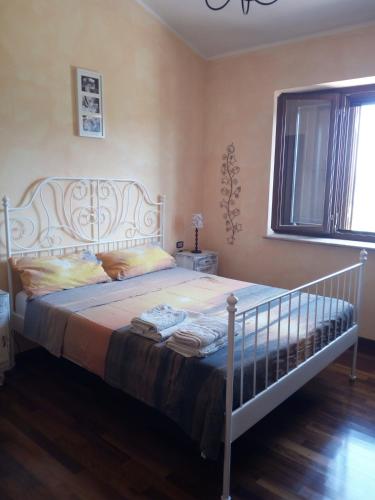 a bedroom with a white bed in a room at Terramadre in Itri