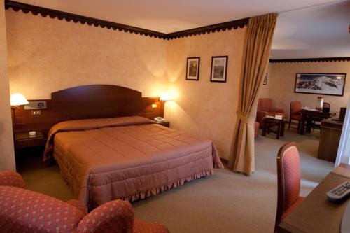 Postel nebo postele na pokoji v ubytování Hotel Pavillon