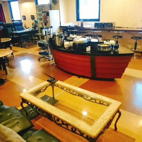 a wooden boat sitting on the floor in a room at Hotel Satellite in Satsumasendai