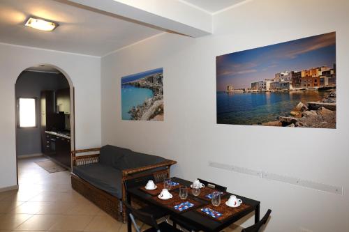 a living room with a couch and a table at Conte Agostino Pepoli in Trapani