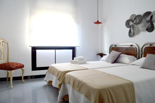 A bed or beds in a room at Ohana Apartamento Rural
