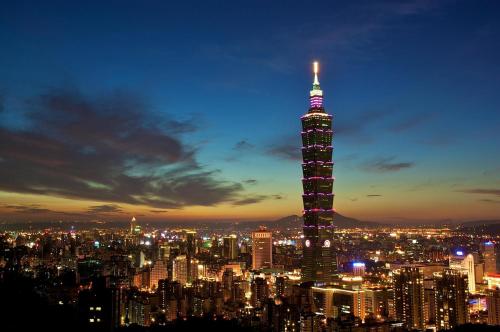 a view of the tokyo tower lit up at night at Hotel East Taipei in Taipei